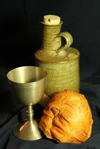  a loaf of bread and a wine goblet