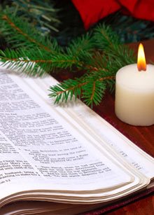 a bible with candle